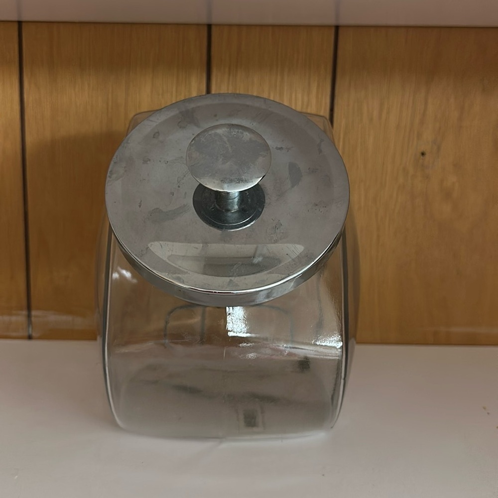 Clear glass container with metal lid